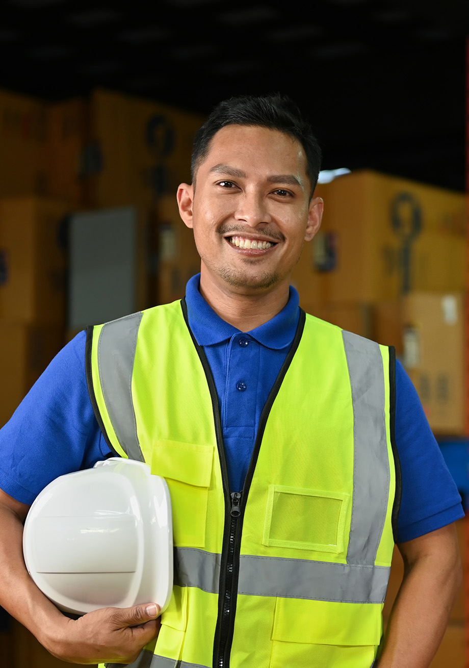 Warehouse team member holding a hard hat
